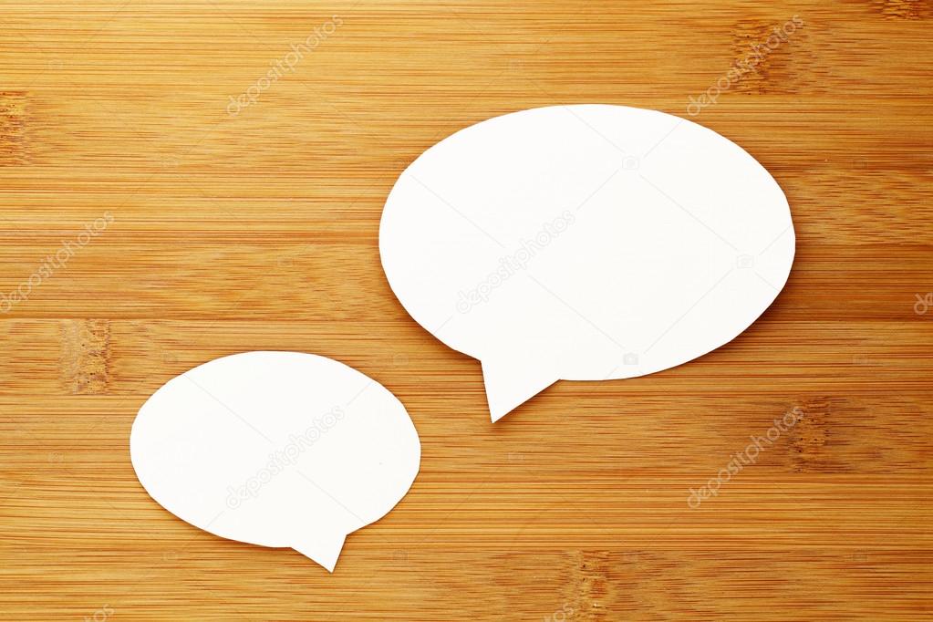 talk speech bubble on wood background