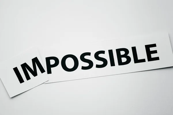 Word impossible cutted to be possible — Stock Photo, Image
