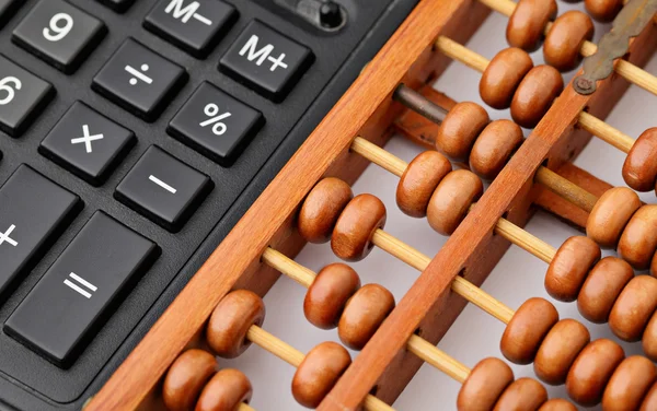 Calculator and abacus — Stock Photo, Image