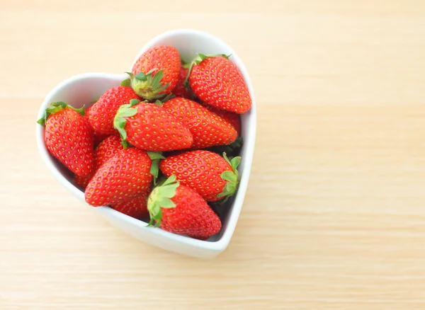 Strawberry in heart shape bowl — Stock Photo, Image