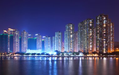 Apartment building in Hong Kong at night clipart