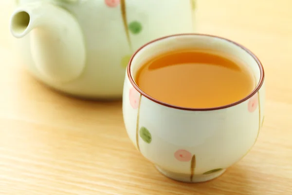 Cup of tea with teapot — Stock Photo, Image