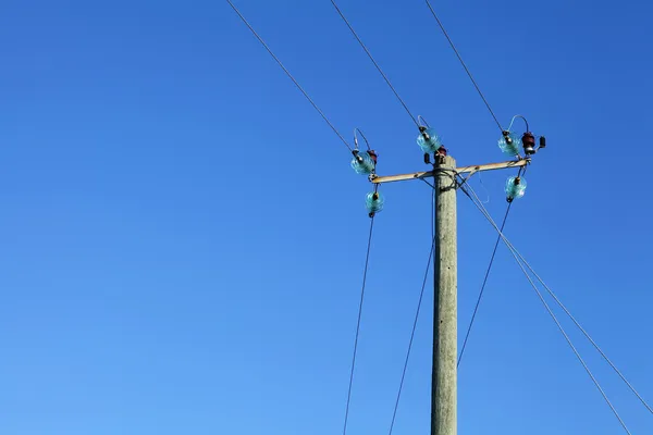 Powerline on wooden pillar — Stock Photo, Image