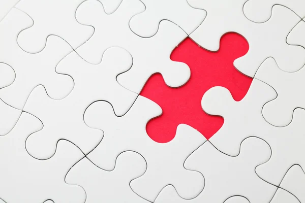 Missing puzzle piece in red — Stock Photo, Image