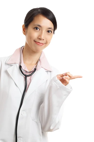 Asian doctor pointing a side — Stock Photo, Image