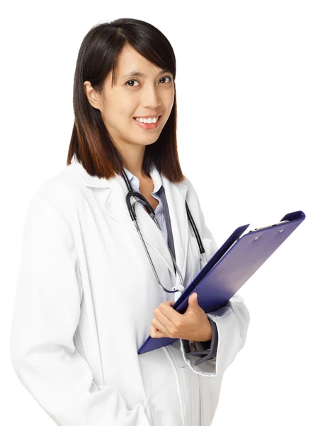 Asian female doctor with writing pad — Stock Photo, Image