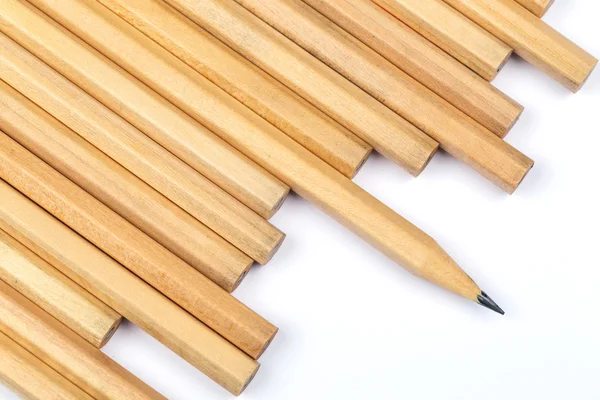 Montón de lápiz nuevo con un afilador — Foto de Stock