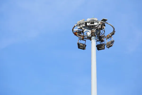 Stadium light with blue sky — Stock Photo, Image