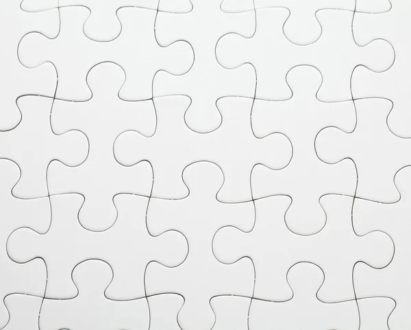 Completed white puzzle — Stock Photo, Image