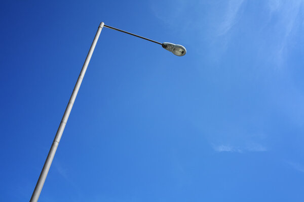 Lighting pole with blue sky