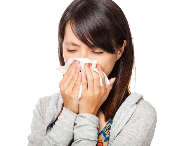 Sneezing woman isolated over white background — Stock Photo, Image