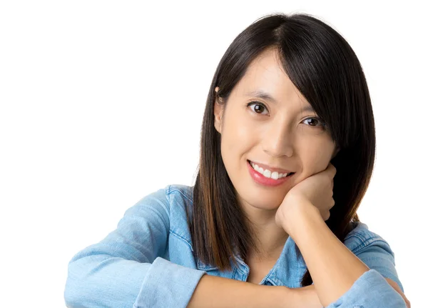 Asian woman with smile lying on table — Stock Photo, Image