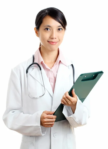 Asian female doctor with writing pad — Stock Photo, Image