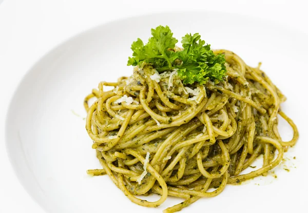 Italian pasta spaghetti with pesto sauce and basil leaf — Stock Photo, Image