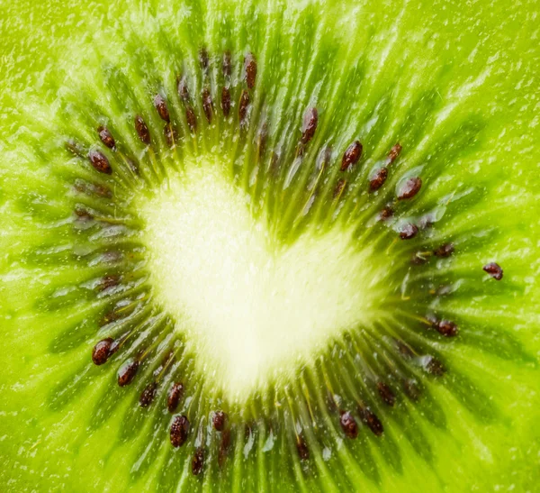 Green kiwi with heart shape — Stock Photo, Image