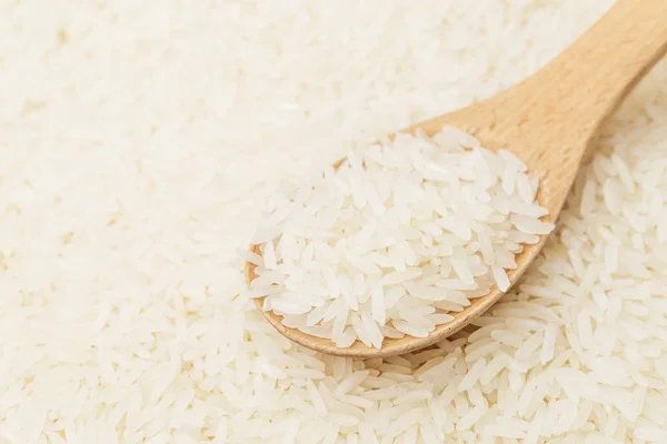 White rice on teaspoon — Stock Photo, Image