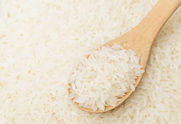 White rice on teaspoon — Stock Photo, Image