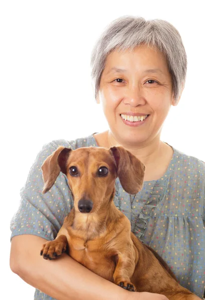 Asian old woman and dachshund dog — Stock Photo, Image