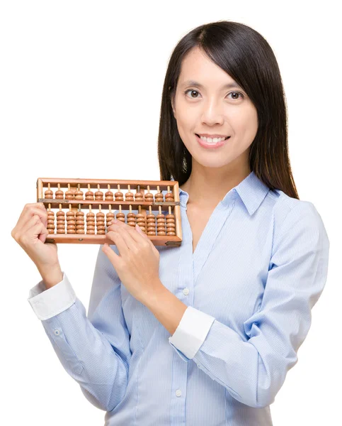 Asian woman holding abacus — Stock Photo, Image