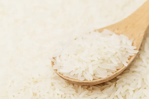 White rice on teaspoon — Stock Photo, Image