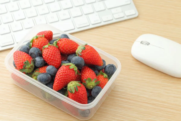 Healthy lunch box in working desk — Stock Photo, Image