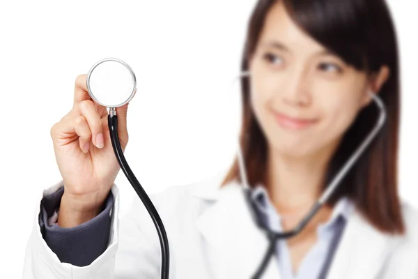 Asian young female doctor holding a stethoscope — Stock Photo, Image