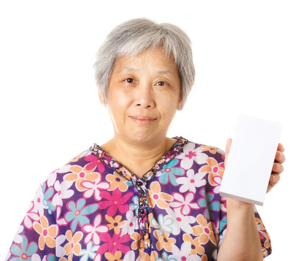 Asian old woman holding blank box — Stock Photo, Image