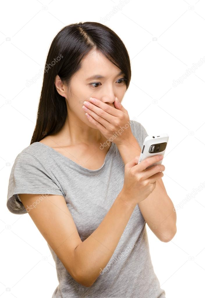Asian woman shocking about the things on mobile