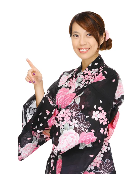 Asian woman wearing kimono and pointing up — Stock Photo, Image