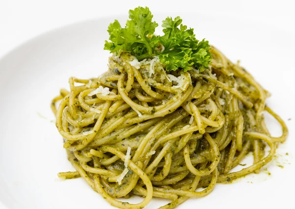 Italian pasta spaghetti with pesto sauce and basil leaf — Stock Photo, Image