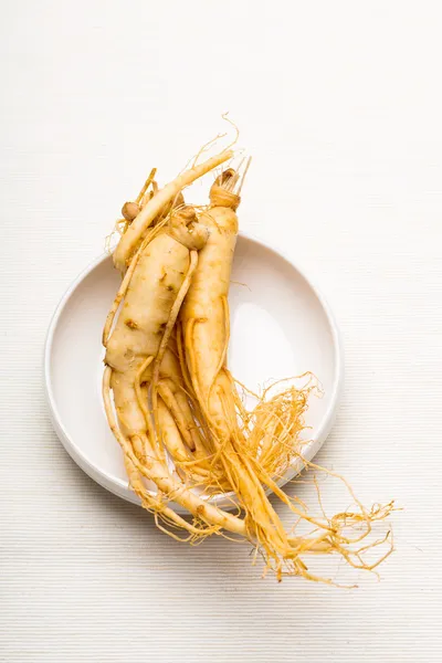 Fresh ginseng on the white bowl — Stock Photo, Image