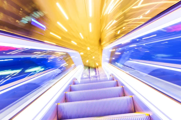 Movement of diminishing hallway escalator — Stock Photo, Image