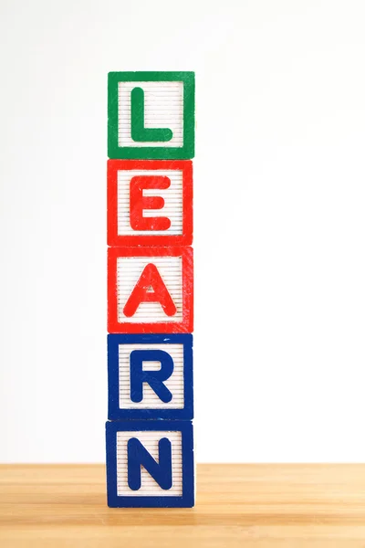 Alphabet building blocks that spelling the word learn Stock Picture