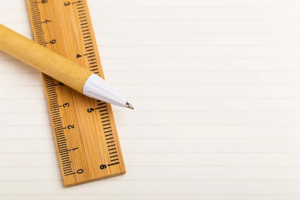 Pen and ruler on the single line paper — Stock Photo, Image
