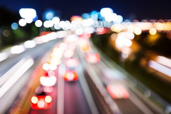 Blurred unfocused highway view at night — Stock Photo, Image