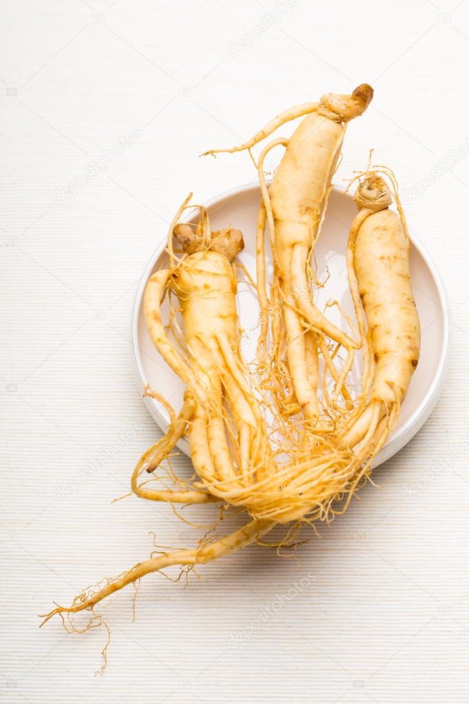 Fresh Ginseng over the white background