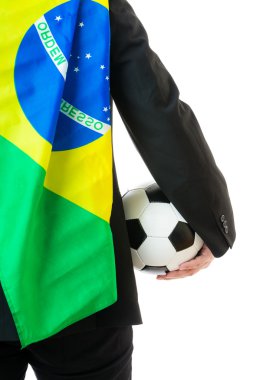 Futbol topu ve Brezilya bayrak tutan işadamı