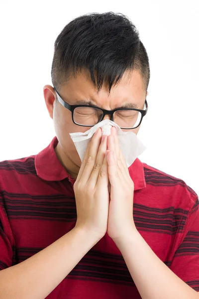 Asian man sneezing isolated on white — Stock Photo, Image