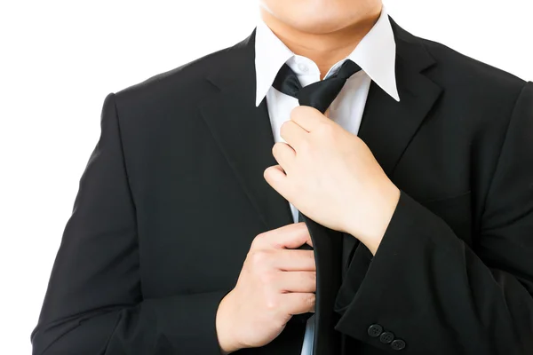 Businessman adjusting tie isolated on white — Stock Photo, Image