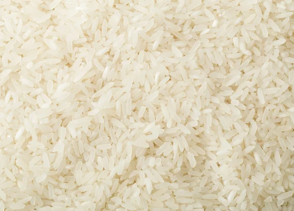 Uncooked white rice background — Stock Photo, Image