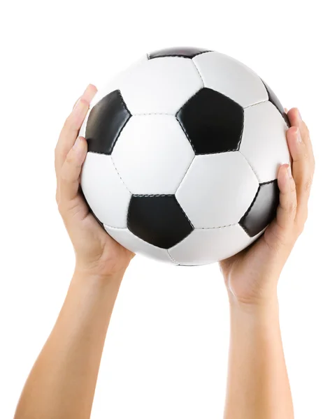 Mãos segurando bola de futebol para cima — Fotografia de Stock