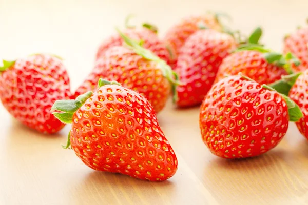 Sweet strawberry over wooden background — Stock Photo, Image