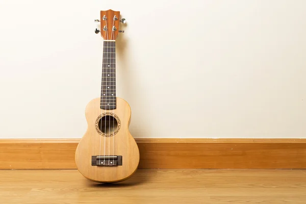 Ukulele on the floor — Stock Photo, Image