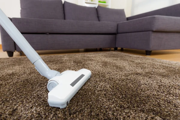 Vacuum cleaner using in living room — Stock Photo, Image