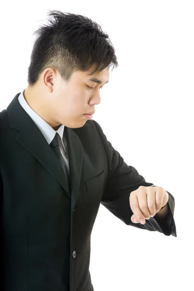 Asian businessman looking at watch — Stock Photo, Image