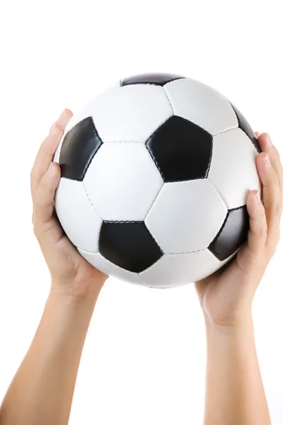 Soccer ball raised by hand — Stock Photo, Image