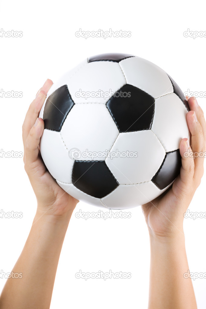 Soccer ball raised by hand