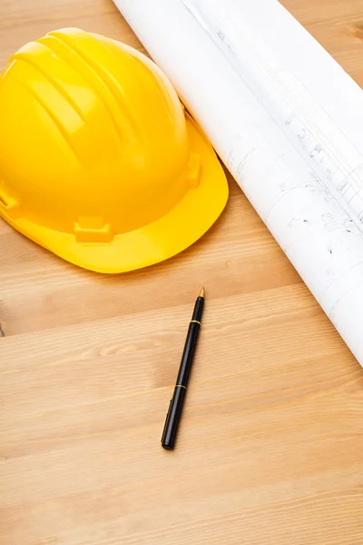 Construction blue print and safety helmet — Stock Photo, Image