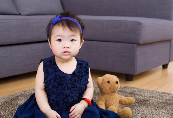 Baby girl and doll bear at home — Stock Photo, Image