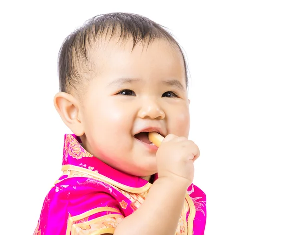 Bebê chinês comer biscoito — Fotografia de Stock